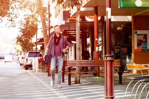 Man walking exploring city center