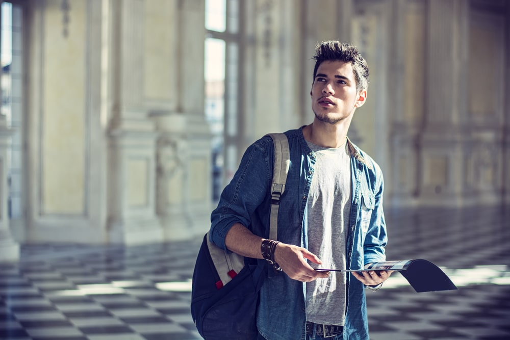 Man walking indoors in a museum