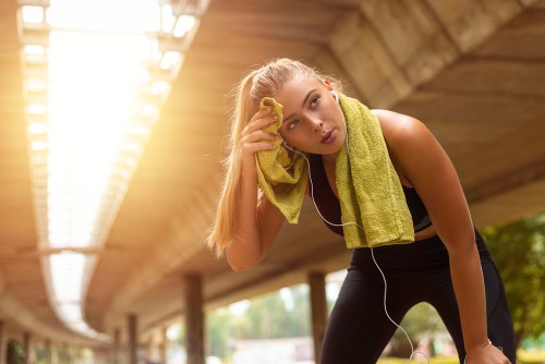 Woman taking a break after an intense workout