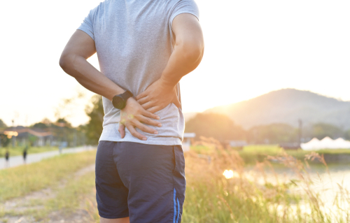 Man holding painful lower back