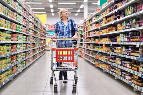 Woman walking in supermarket