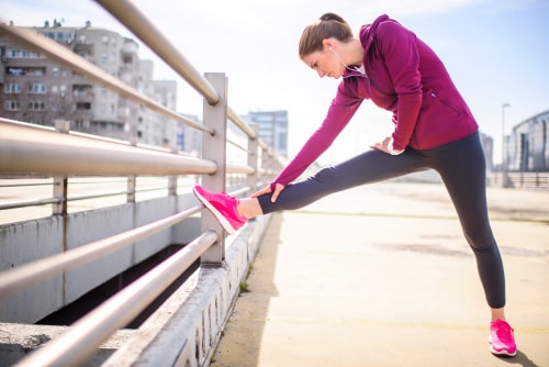 Woman stretching before a run