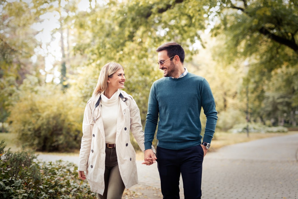 Man and woman walking together outside