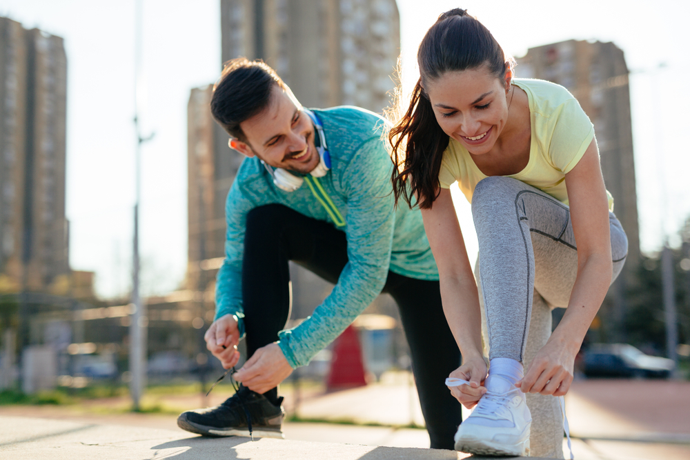 Runners tying their shoes before a run