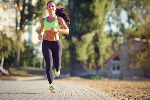 Fit woman jogging in a suburban street