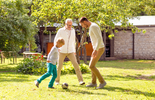 Dad and grandpa playing with kid