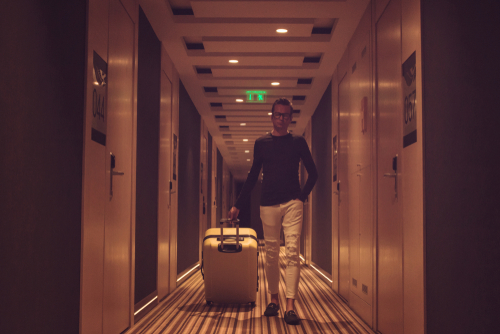 Walking in hotel hallway