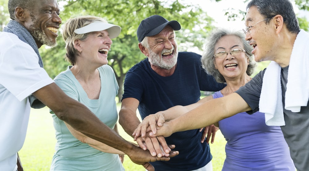 Group of seniors exercising together in a park