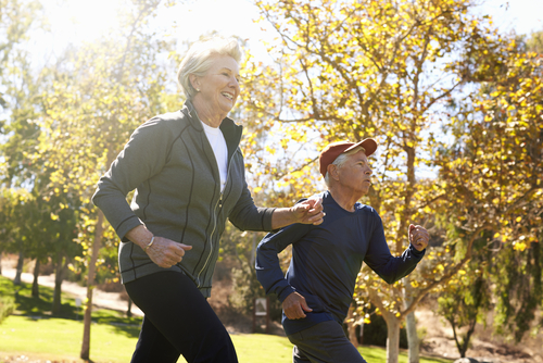 Senior couple power walking in the park