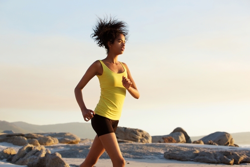 Woman power walking near the beach