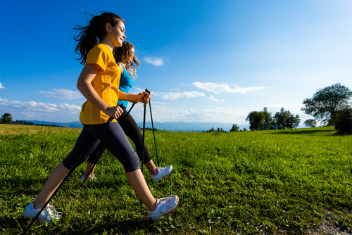 brisk walking with poles in a field