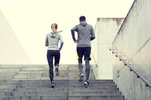 Active joggers running stairs