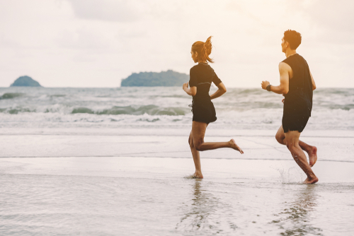 couple running on the beach