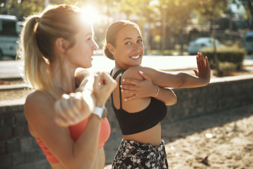 Fit women stretching before a workout
