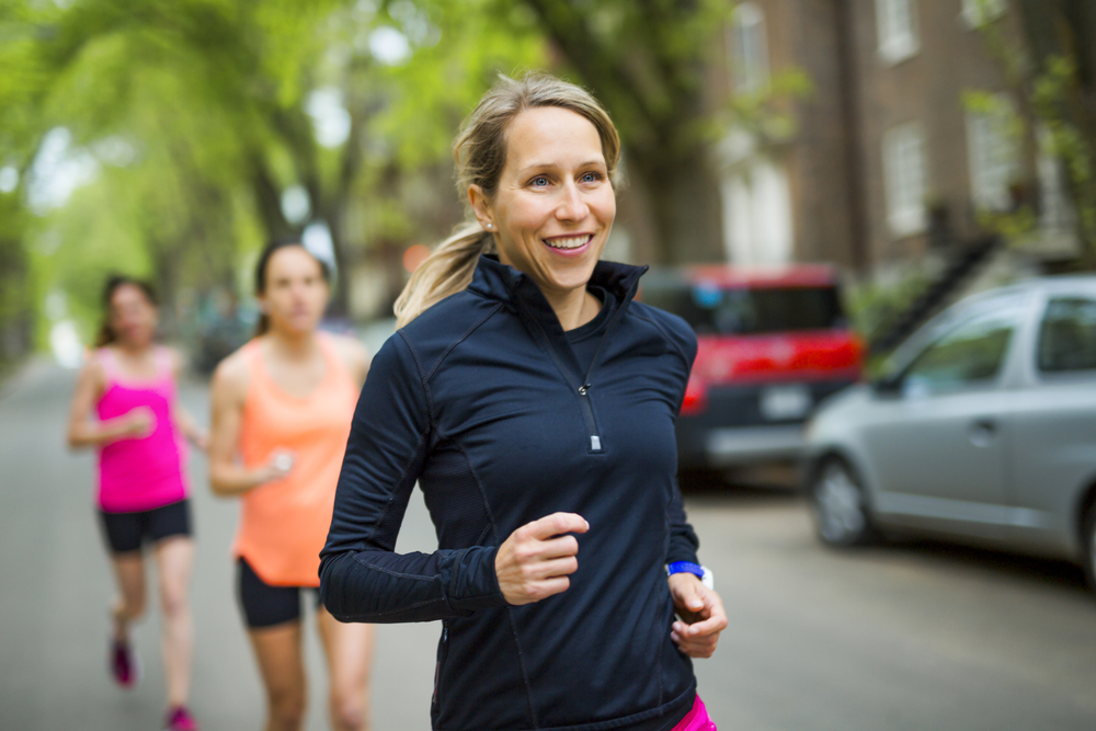 Woman doing some intense walking with friends