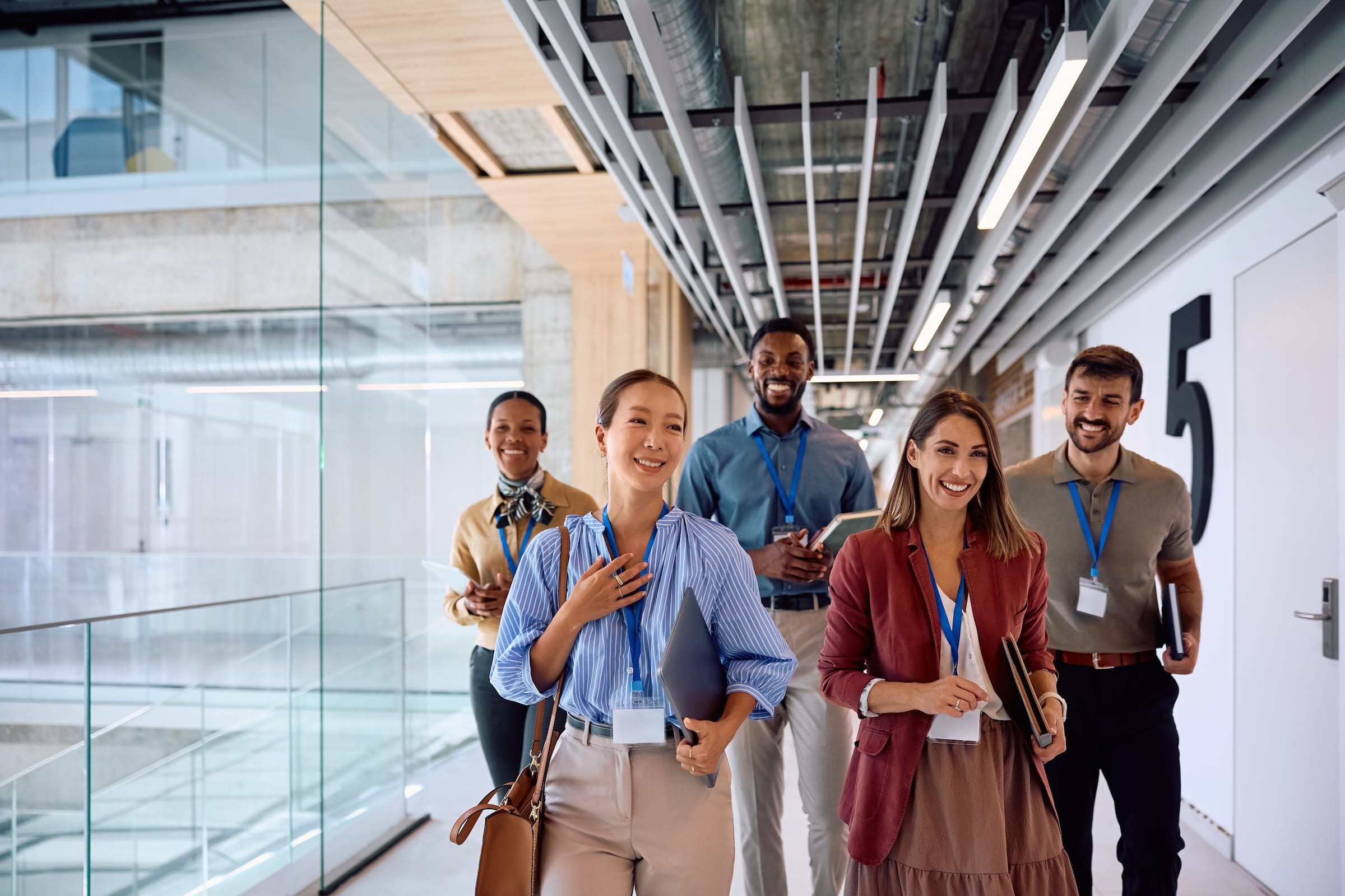 A workplace step challenge team walking together through the office