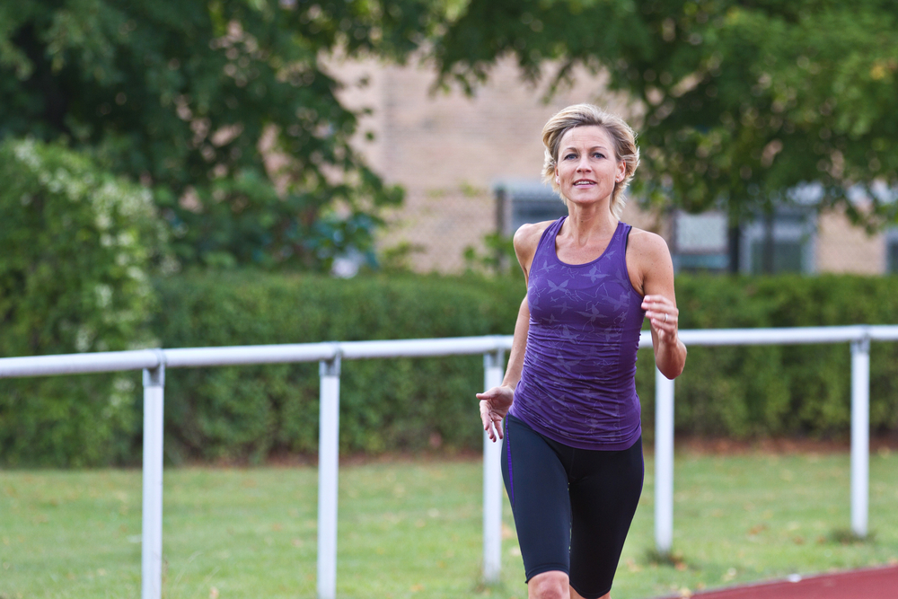 Woman speed walking on a walking track