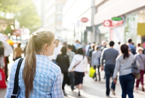 Woman walking in a crowded city street