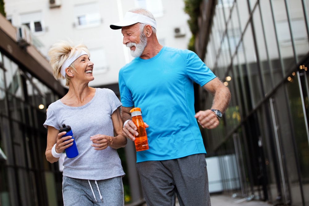 Senior couple walking or jogging for fitness