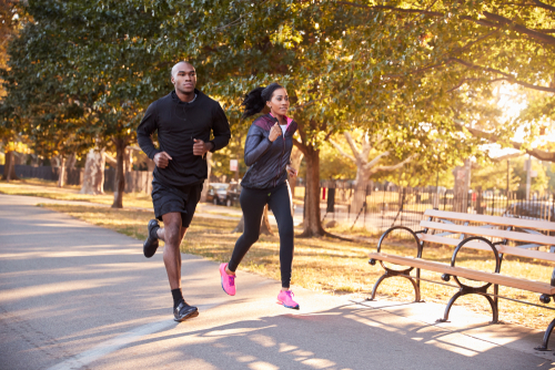 Young couple running in the park