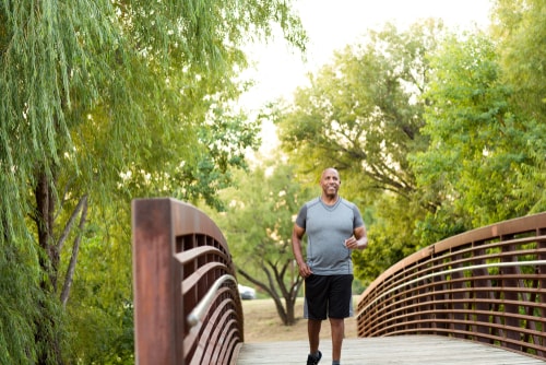 Man walking in park for fitness