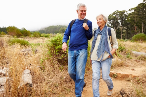 Senior couple walking in the countryside