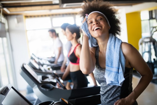 Woman sweating after treadmill cardio workout