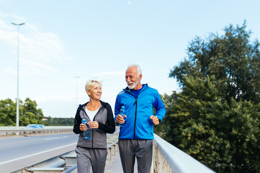 Active seniors walking on a bridge