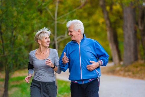 Senior couple walking in park