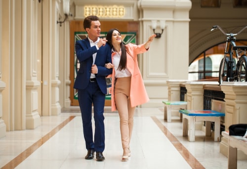 Couple walking indoors in the mall