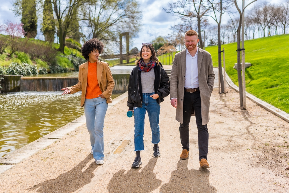 Colleagues walking together outside their office during a workplace step challenge