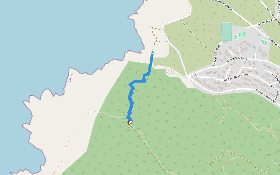 Hiking path marked by a red triangle walking route map in Stintino